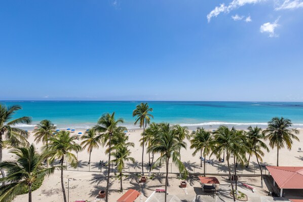 On the beach, sun loungers, beach towels