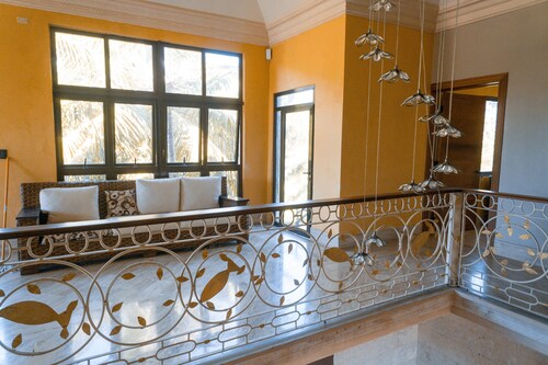 Luxurious villa with private beach access and spacious gardens