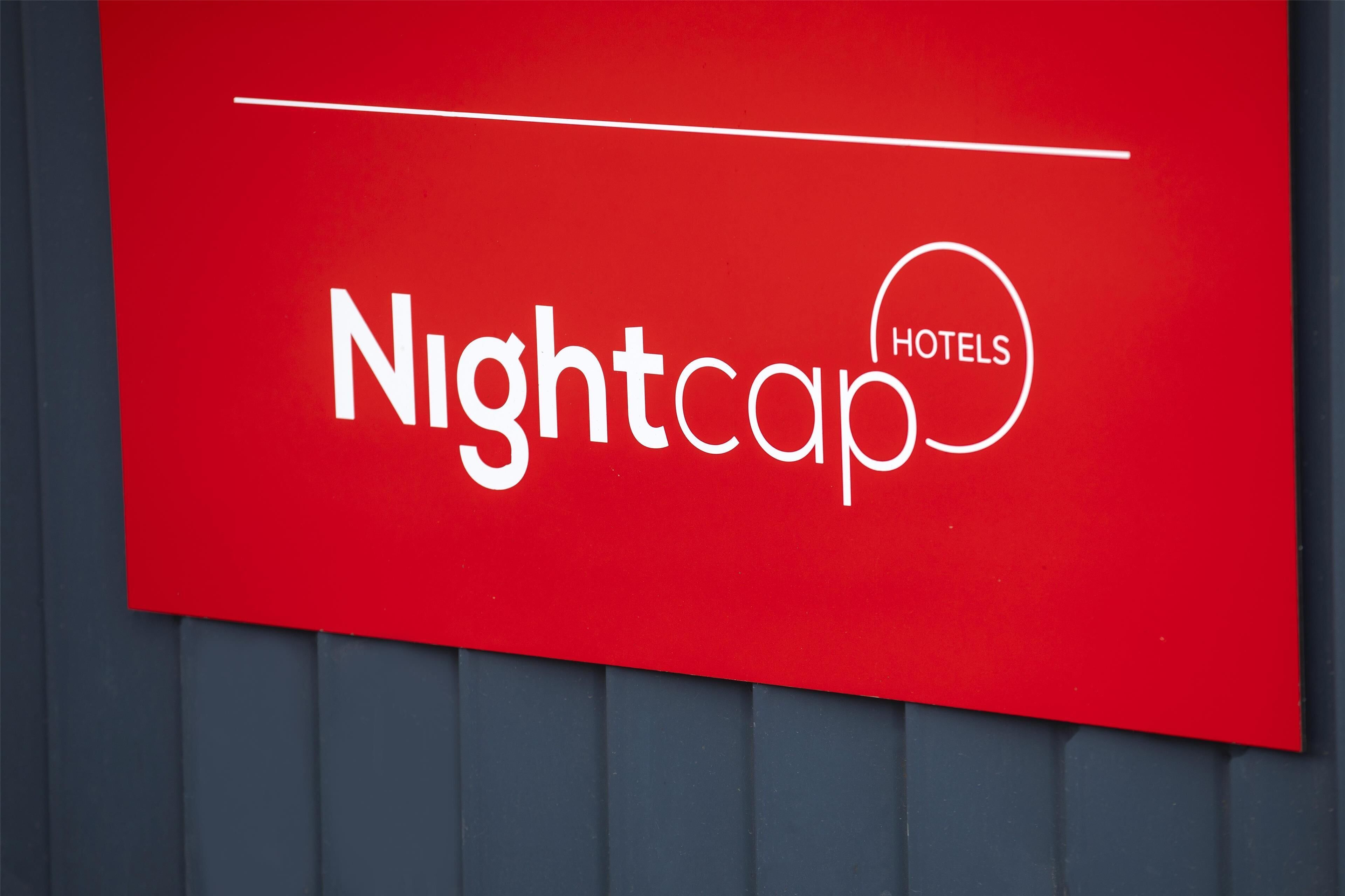 A red sign with the text "Nightcap Hotels."