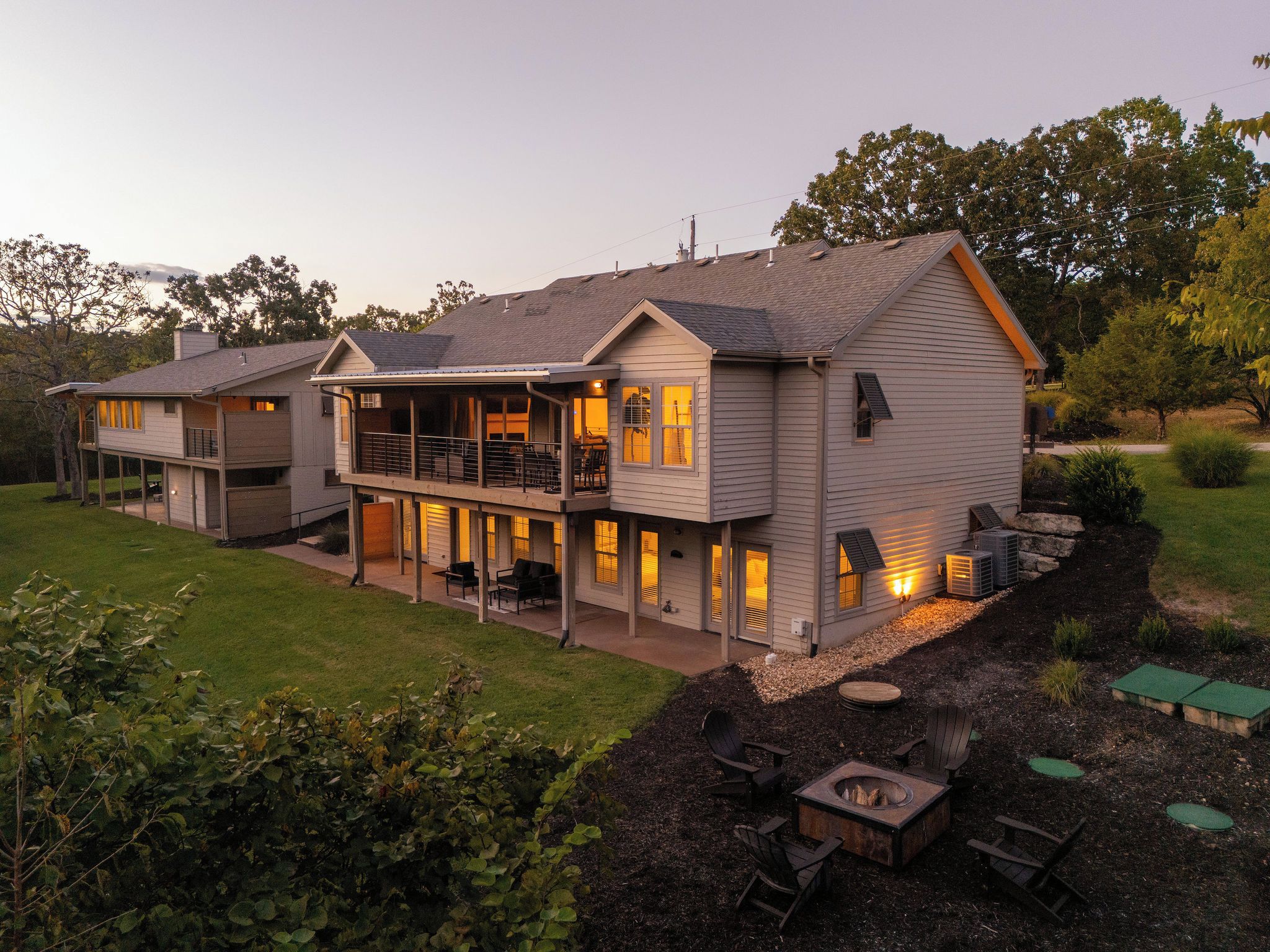 Maia lit up at dusk, with decks on both levels