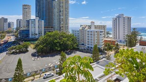 A cityscape with high-rise buildings and a parking lot. - Serain Residences on View  (Surfers Paradise)