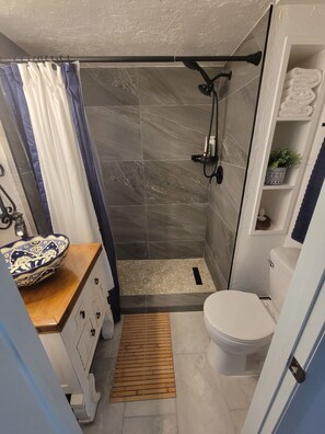 Shower, hair dryer, towels, soap