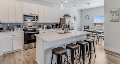 Dog-friendly ocean view home with an enclosed yard, washer/dryer, & central AC