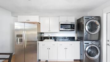 Fridge, microwave, coffee/tea maker, cookware/dishes/utensils