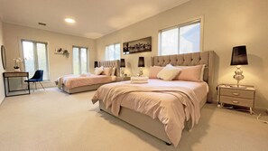A bedroom with two beds, a desk, and a chair. - Spacious 7BRM 5-bathroom Rental House (Point Cook)