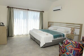 Family Room | Free minibar items, desk, laptop workspace, soundproofing