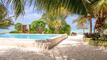 Outdoor pool, open 8:00 AM to 7:00 PM, pool umbrellas, pool loungers