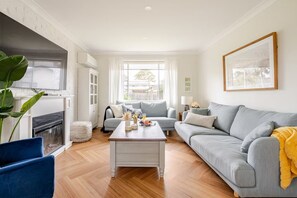 Smart TV, DVD player, foosball, books