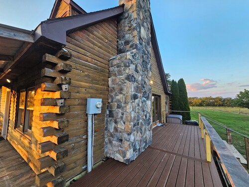 Escape to the Modern Log home sitting on a captivating 62-acre farm.