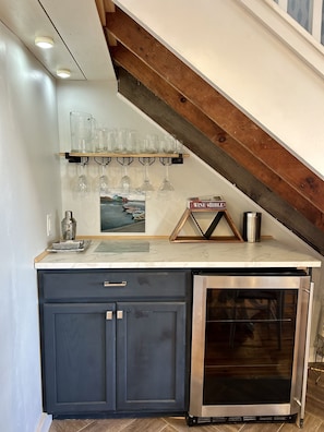 Enjoy cooking in this cozy kitchen with an oven, sink, and ample storage.