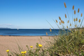 On the beach, sun loungers