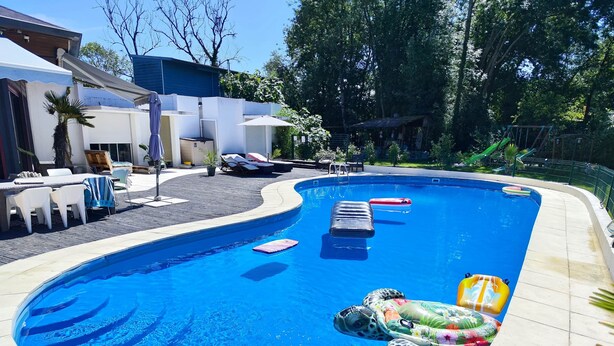 A swimming pool with lounge chairs and a small deck area. - Gîte du Moulin de Tart le Bas (Tart-le-Bas)