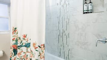 Bathtub, hair dryer, towels