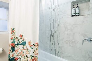 Bathtub, hair dryer, towels