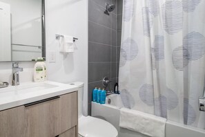 Bathtub, hair dryer, towels