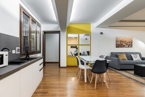 Business Apartment | Living area | 35-inch TV with digital channels - Strada Maggiore Apts by Wonderful Italy (Bologna)