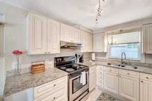 Fridge, microwave, oven, stovetop - Serene oceanfront suite with Gulf view, grill, patio, central AC, & W/D (Holmes Beach)