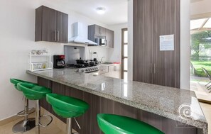 Microwave, oven, coffee/tea maker, cookware/dishes/utensils