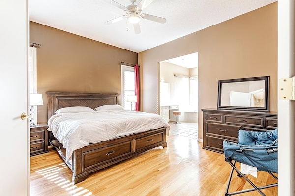 Massive Master bedroom with large ensuite bathroom and a king bed