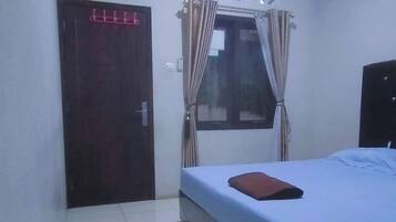 Deluxe Room | 1 bedroom, down comforters, individually furnished, blackout drapes