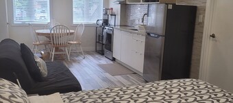 Cozy and modern bachelor suite with kitchenette and bath