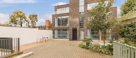 A modern building with large windows and a brick facade.