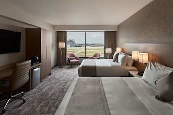 In-room safe, desk, laptop workspace, blackout drapes at Great Canadian Casino Resort Toronto