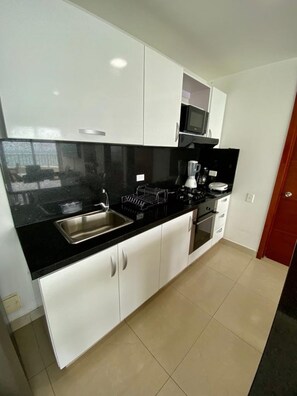 Microwave, stovetop, dishwasher, coffee/tea maker