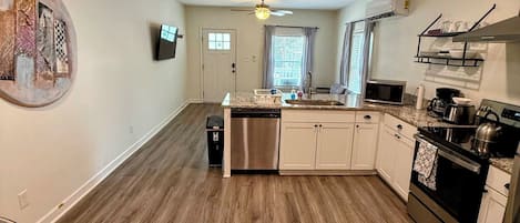 Coffee/tea maker, fridge, microwave, oven
