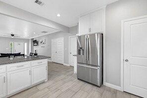 Fridge, cookware/dishes/utensils, dining tables