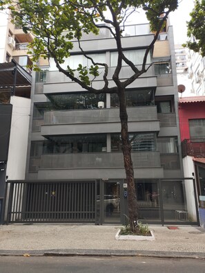 A multi-story building with a modern design, featuring balconies and large windows. - 4 Minutes From Ipanema Beach Fa202 (Rio de Janeiro)