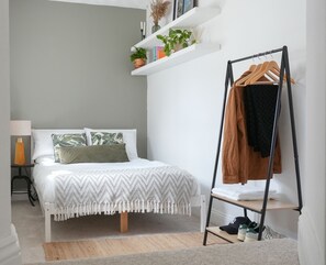 1 bedroom, desk, iron/ironing board, travel crib