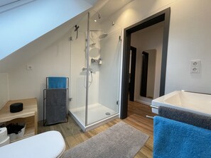 Shower, hair dryer, towels, soap