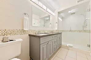 Shower, hair dryer, towels, shampoo