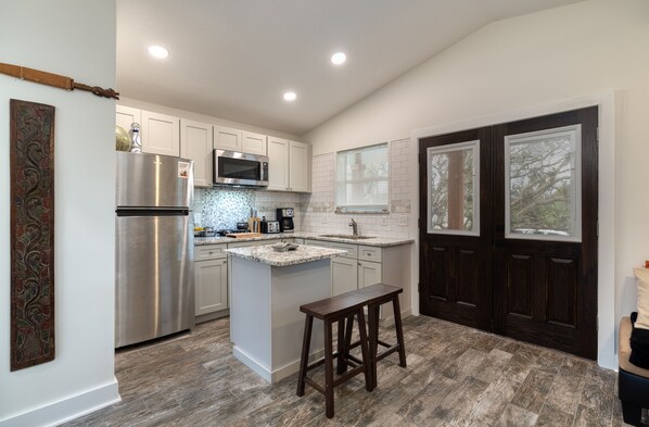 Fridge, microwave, stovetop, coffee/tea maker