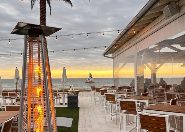 Enjoy al fresco dining with ocean views and warm ambiance.