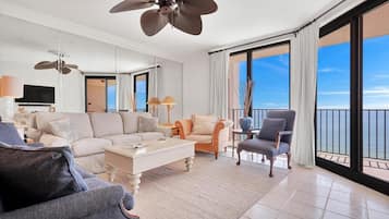 Condo, Multiple Beds, Balcony, Ocean View | Living area | 50-inch flat-screen TV with cable channels, TV