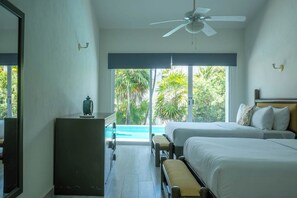 A hotel room with two beds, a ceiling fan, a view of a swimming pool, and a large window. - Matuk 3 (Playa del Carmen)