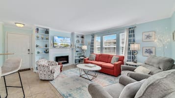 Condo, Multiple Beds, Balcony | Living area | 43-inch flat-screen TV with cable channels, TV