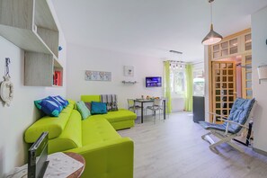 Family Apartment, Multiple Bedrooms (Marina's Green Home) | Living area | 21-inch Smart TV with digital channels