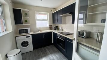 House, Multiple Beds | Private kitchen | Fridge, microwave, oven, stovetop
