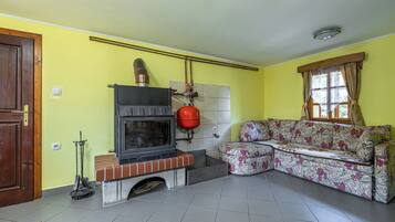 Family House, Multiple Bedrooms, 2 Bathrooms (Kunstek Farmhouse With Sauna) | Living area | 21-inch flat-screen TV with cable channels, TV, fireplace