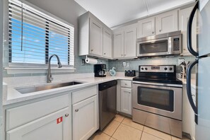 Condo, Multiple Beds, Balcony | Private kitchen | Fridge, microwave, oven, stovetop