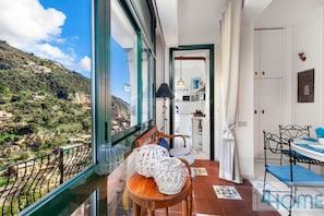 Enjoy a panoramic view of the surrounding mountains from the large window in this room.