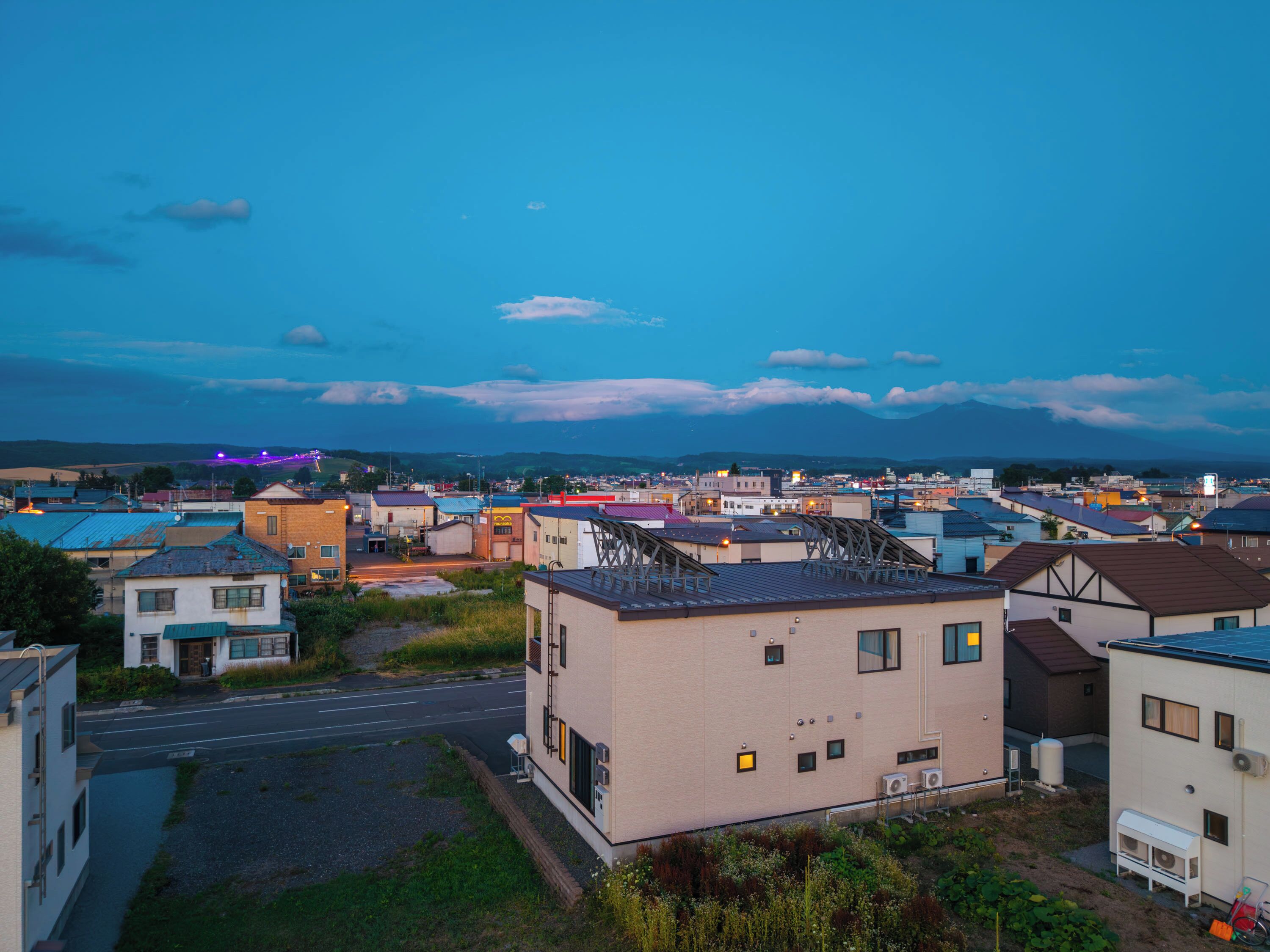 A residential area with houses and a street.