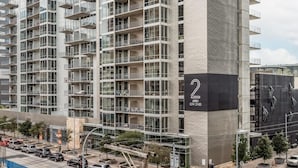 A modern high-rise building with multiple balconies and large windows. - Austin Beautiful 1BD 1BA 2nd Street District Apartment (Austin)