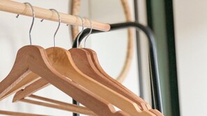 Wooden hangers on a metal rack. - Cozy Home Sint Philipsland With 2 Bathrooms (Sint Philipsland)