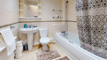 Bathtub, hair dryer, towels