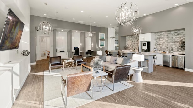 A modern living room with a sofa set, a coffee table, and a dining area with a kitchen in the background. - Arlington Stylish 2BD 2BA Apartment (Arlington)
