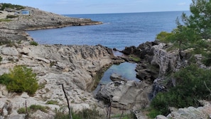 A rocky coastal landscape with a narrow water passage. - Casa Marieli - A 50 m dal Mare con Spazio Esterno (Gagliano del Capo)